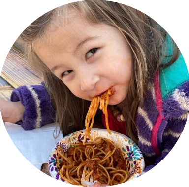 girl eating tempeh spag bol